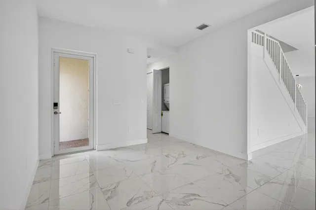 a bathroom with a glass shower door