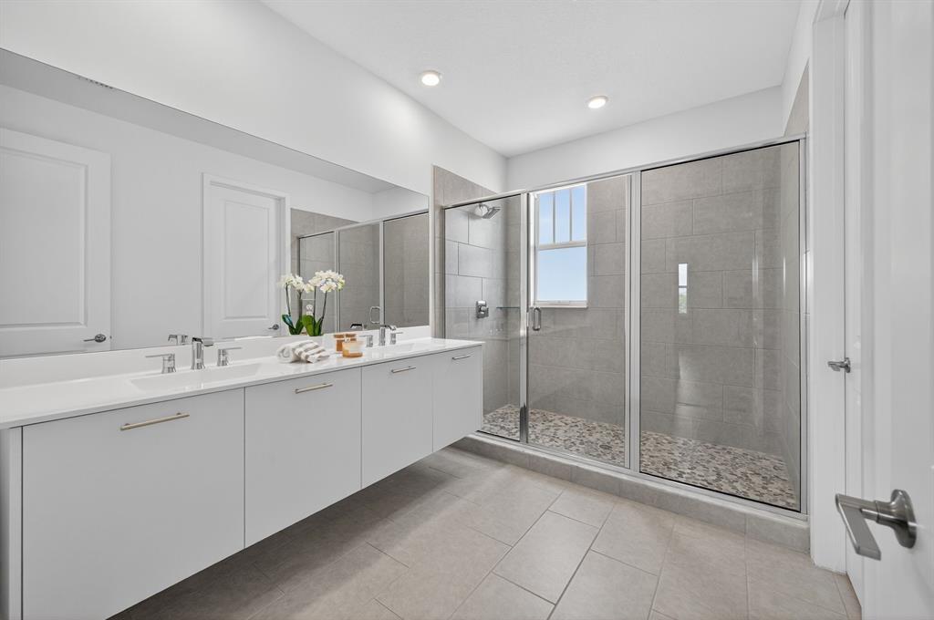 4421 Southwest 123rd Avenue Davie, FL 33330 - Photo 35 of 62 a bathroom with a shower sink and mirror