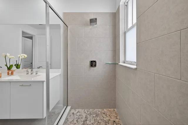 an empty room with wooden floor and a window