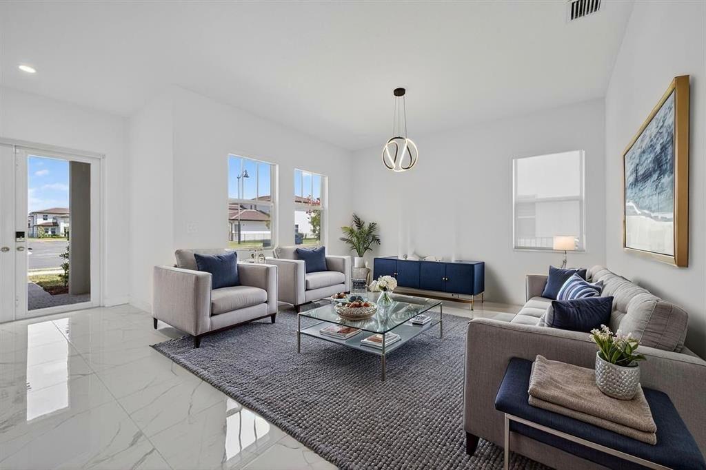 4421 Southwest 123rd Avenue Davie, FL 33330 - Photo 4 of 62 a living room with furniture and wooden floor