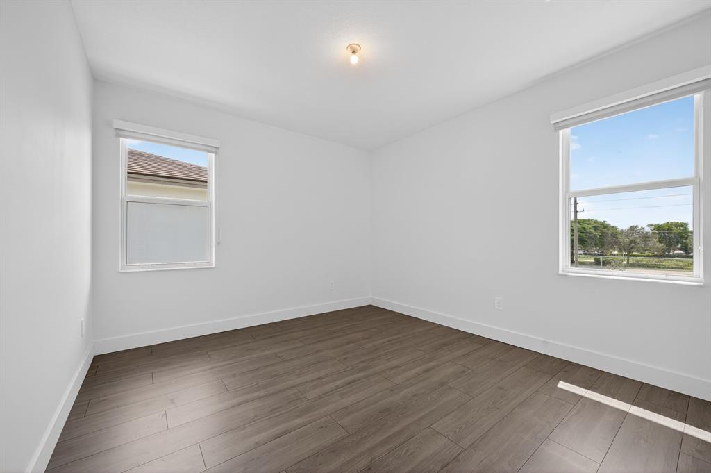 4421 Southwest 123rd Avenue Davie, FL 33330 - Photo 43 of 62 a view of an empty room with wooden floor and a window