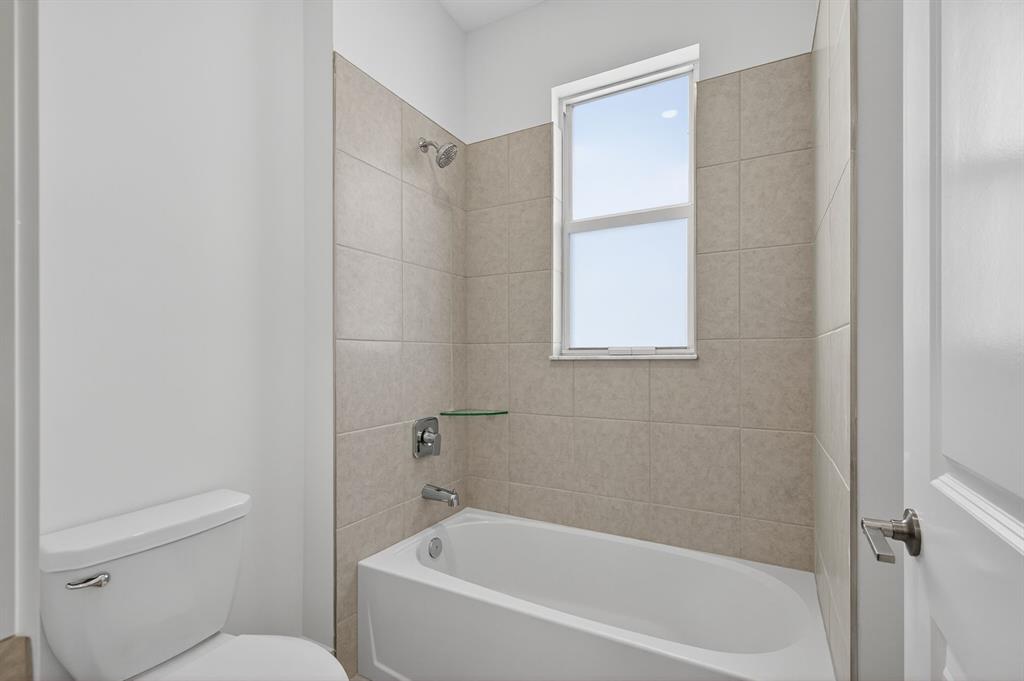 4421 Southwest 123rd Avenue Davie, FL 33330 - Photo 46 of 62 a white bath tub sitting next to a toilet