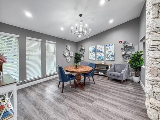 a living room with furniture a window and a table