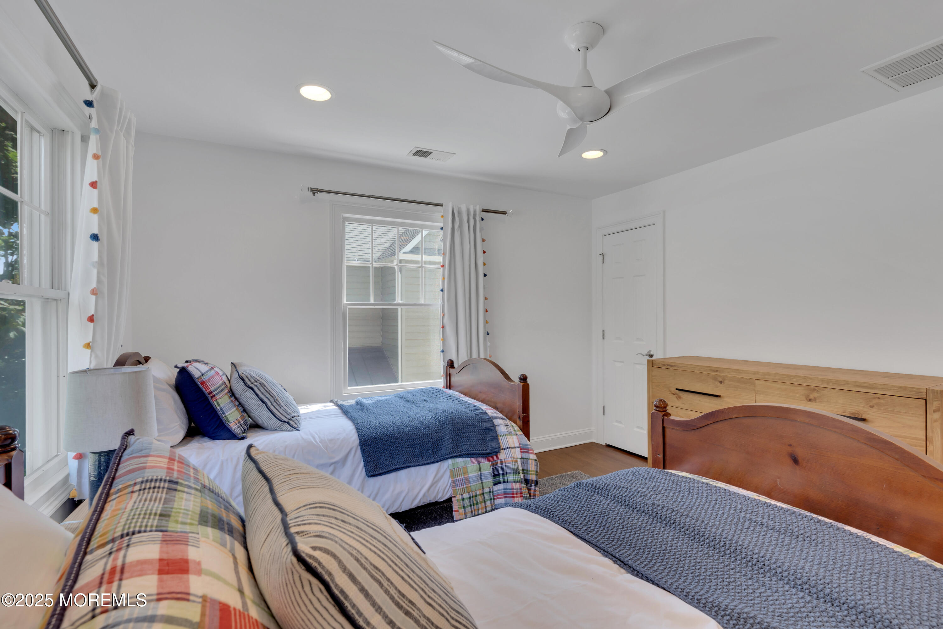 57 W River Road Rumson, NJ 07760 - Photo 20 of 44 a bedroom with two beds and painted walls