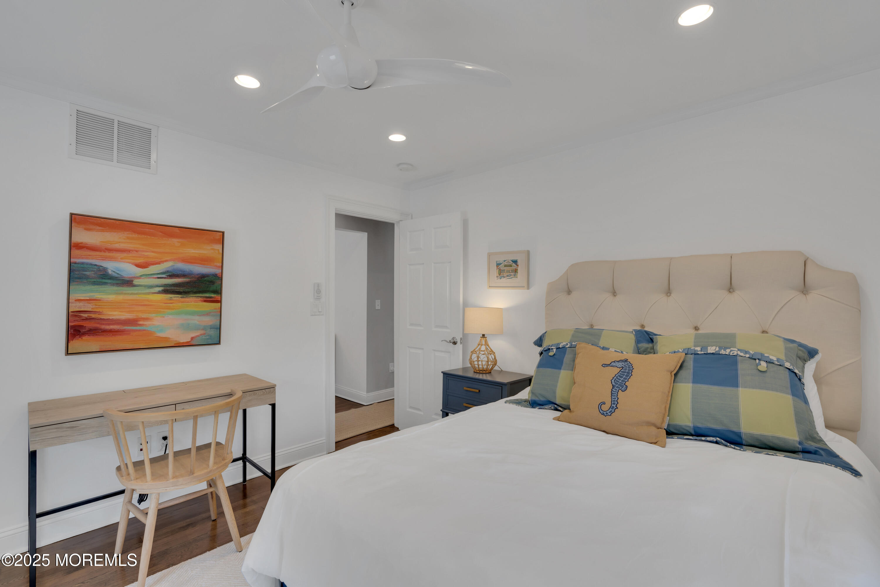 57 W River Road Rumson, NJ 07760 - Photo 23 of 44 a bedroom with a bed and painting on the wall