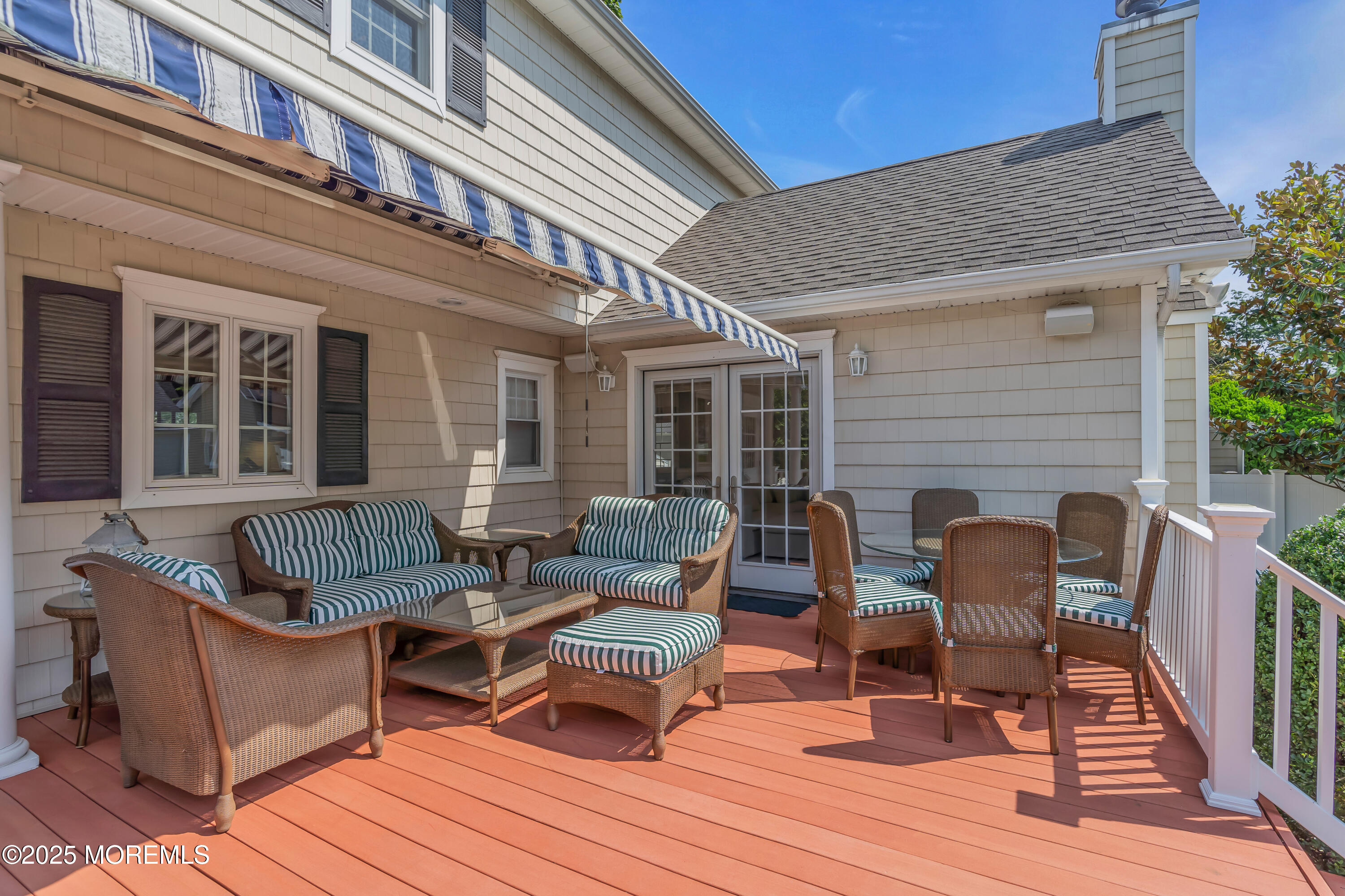 57 W River Road Rumson, NJ 07760 - Photo 34 of 44 a balcony with furniture and wooden floor