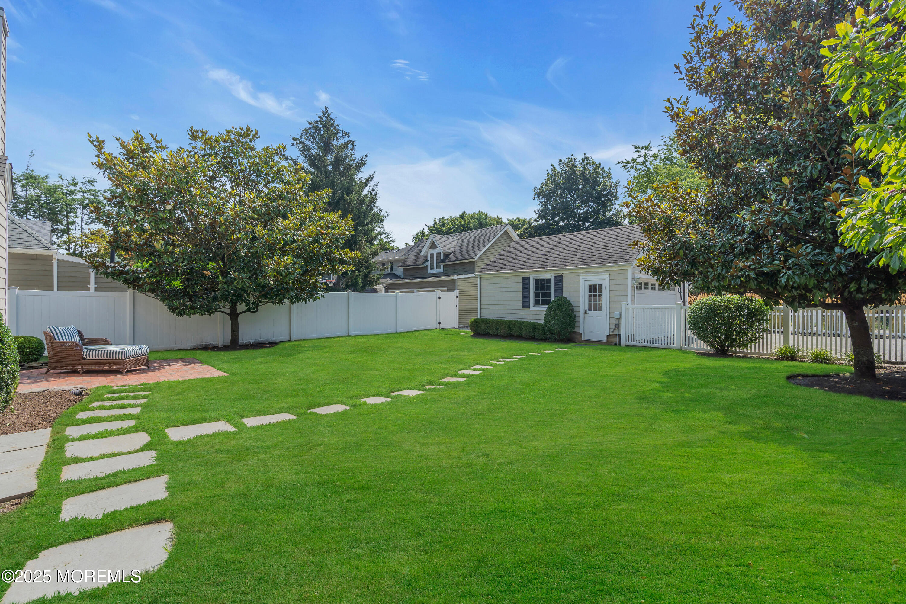 57 W River Road Rumson, NJ 07760 - Photo 38 of 44 a view of a house with a backyard