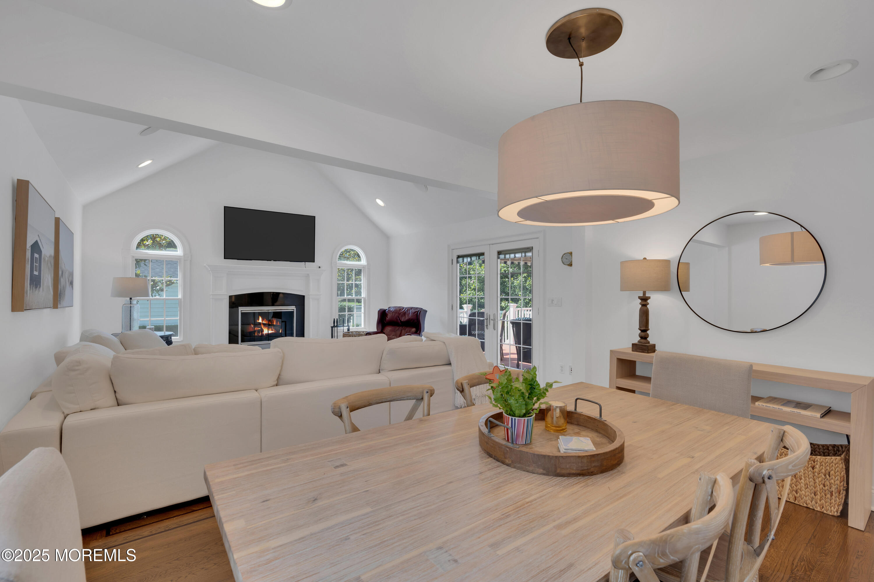 57 W River Road Rumson, NJ 07760 - Photo 8 of 44 a living room with furniture a fireplace and a mirror