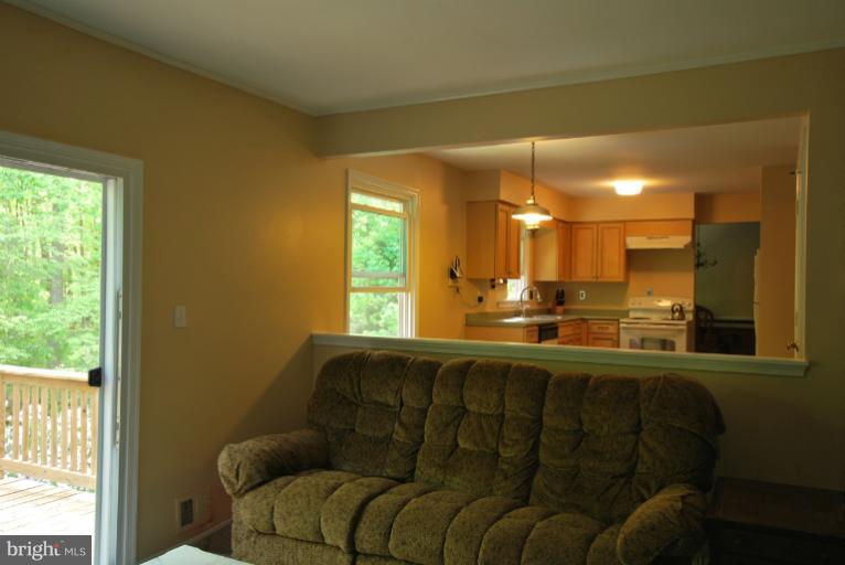 13628 Middlevale Lane Silver Spring, MD 20906 - Photo 14 of 25 a living room with furniture and a large window