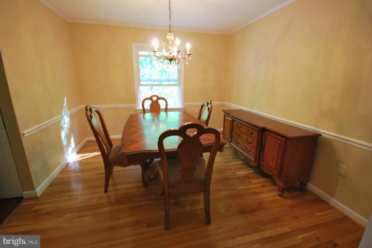 13628 Middlevale Lane Silver Spring, MD 20906 - Photo 3 of 25 a view of a dining room with furniture and chandelier
