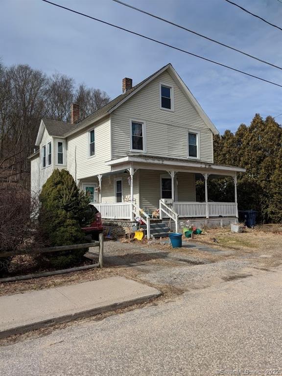 357 South Windham Road Windham, CT 06226 - Photo 1 of 1 a view of a white house with large windows and a car parked in front of it