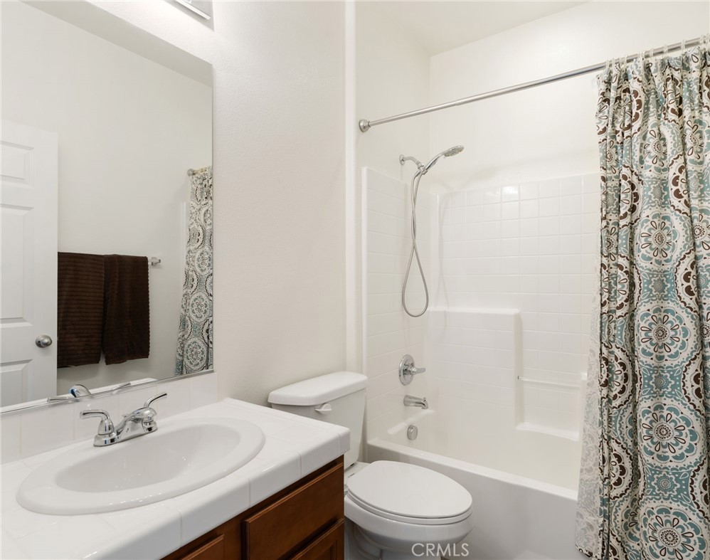 46545 Peach Tree Street Temecula, CA 92592 - Photo 14 of 48 a bathroom with a sink toilet and shower