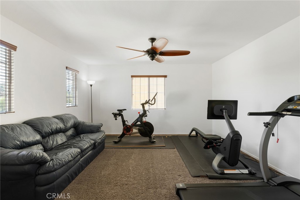 46545 Peach Tree Street Temecula, CA 92592 - Photo 17 of 48 a living room with furniture a air conditioner and a window