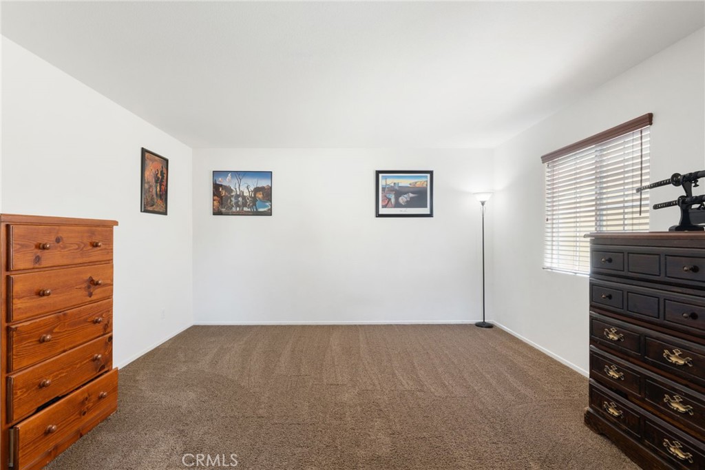 46545 Peach Tree Street Temecula, CA 92592 - Photo 27 of 48 a view of room with window and dresser