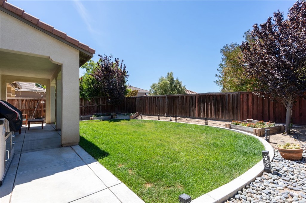46545 Peach Tree Street Temecula, CA 92592 - Photo 35 of 48 a view of a backyard with a garden