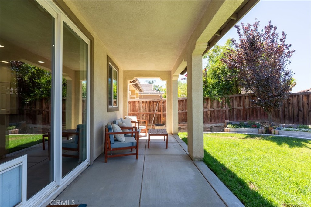 46545 Peach Tree Street Temecula, CA 92592 - Photo 36 of 48 a swimming pool with outdoor seating and yard