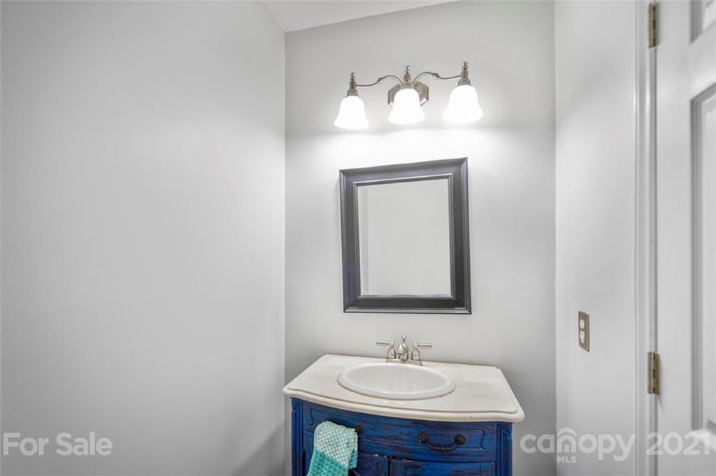 167 Mooreland Road, Unit 94 Mooresville, NC 28117 - Photo 11 of 34 a bathroom with a sink vanity and mirror