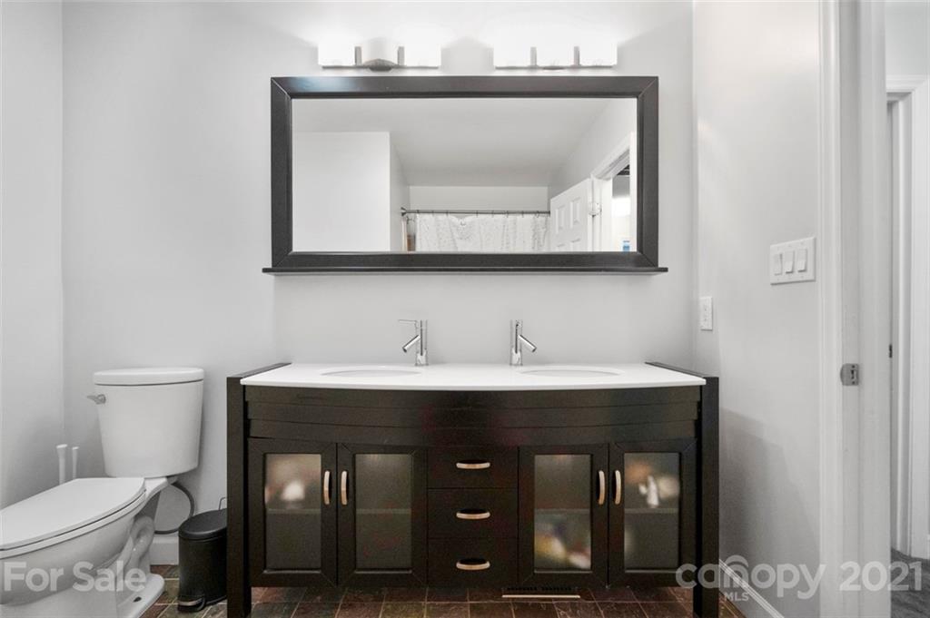 167 Mooreland Road, Unit 94 Mooresville, NC 28117 - Photo 25 of 34 a bathroom with a toilet sink and mirror