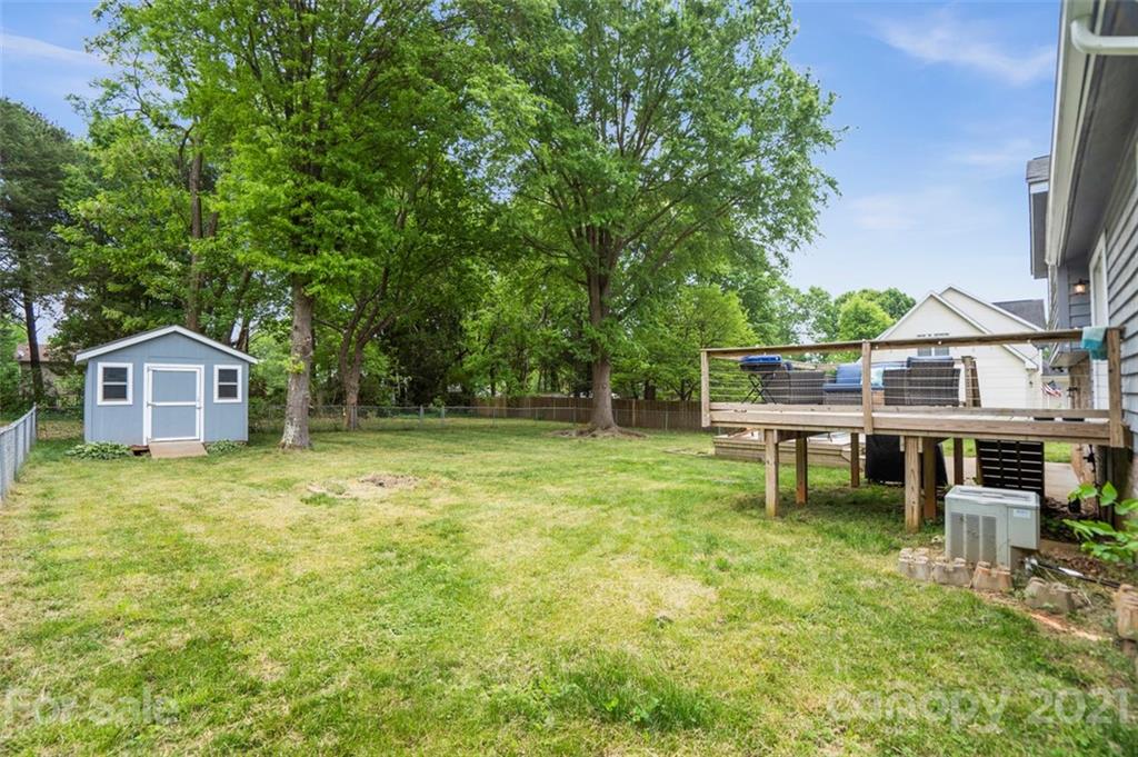 167 Mooreland Road, Unit 94 Mooresville, NC 28117 - Photo 30 of 34 a backyard of a house with table and chairs