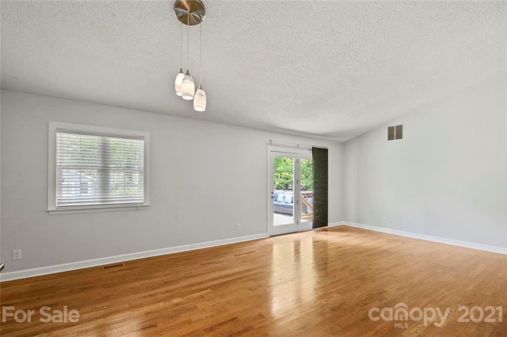 167 Mooreland Road, Unit 94 Mooresville, NC 28117 - Photo 7 of 34 wooden floor in an empty room with a window