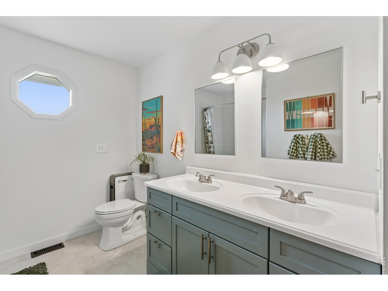 9421 Gunbarrel Ridge Road Boulder, CO 80301 - Photo 27 of 50 a bathroom with a toilet sink and mirror