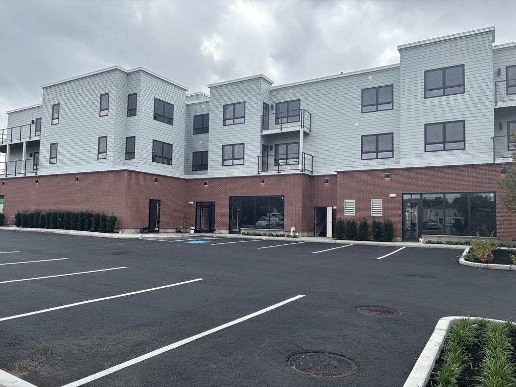 1391 Main Street, Unit 301 Walpole, MA 02081 - Photo 2 of 22 a front view of a building