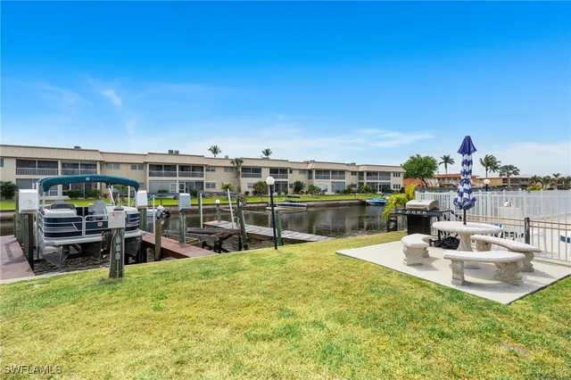 a view of a swimming pool with seating area