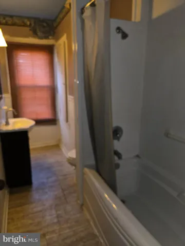 an empty room with wooden floor