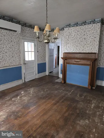 a view of a kitchen with a sink and a fireplace