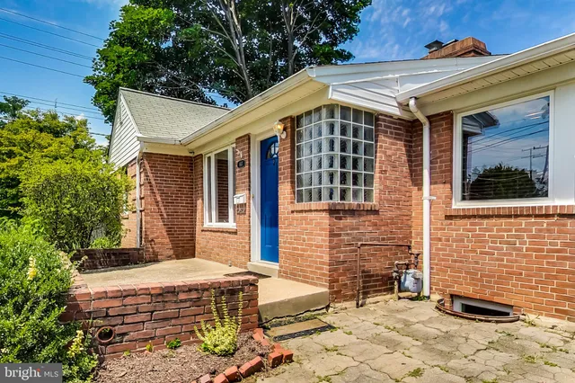 a front view of a house with parking