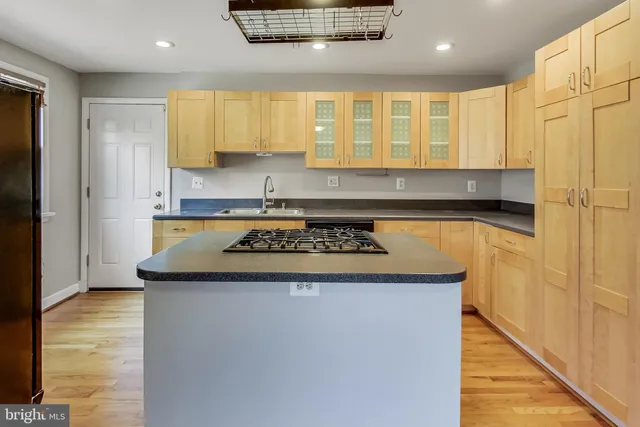 a kitchen with a stove and a refrigerator