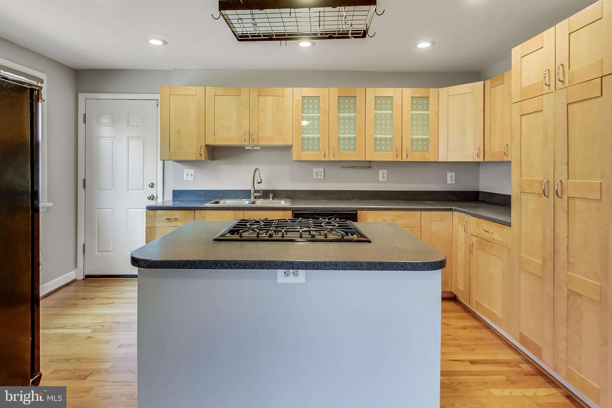 8617 Lynbrook Drive Bethesda, MD 20814 - Photo 19 of 48 a kitchen with a stove and a refrigerator