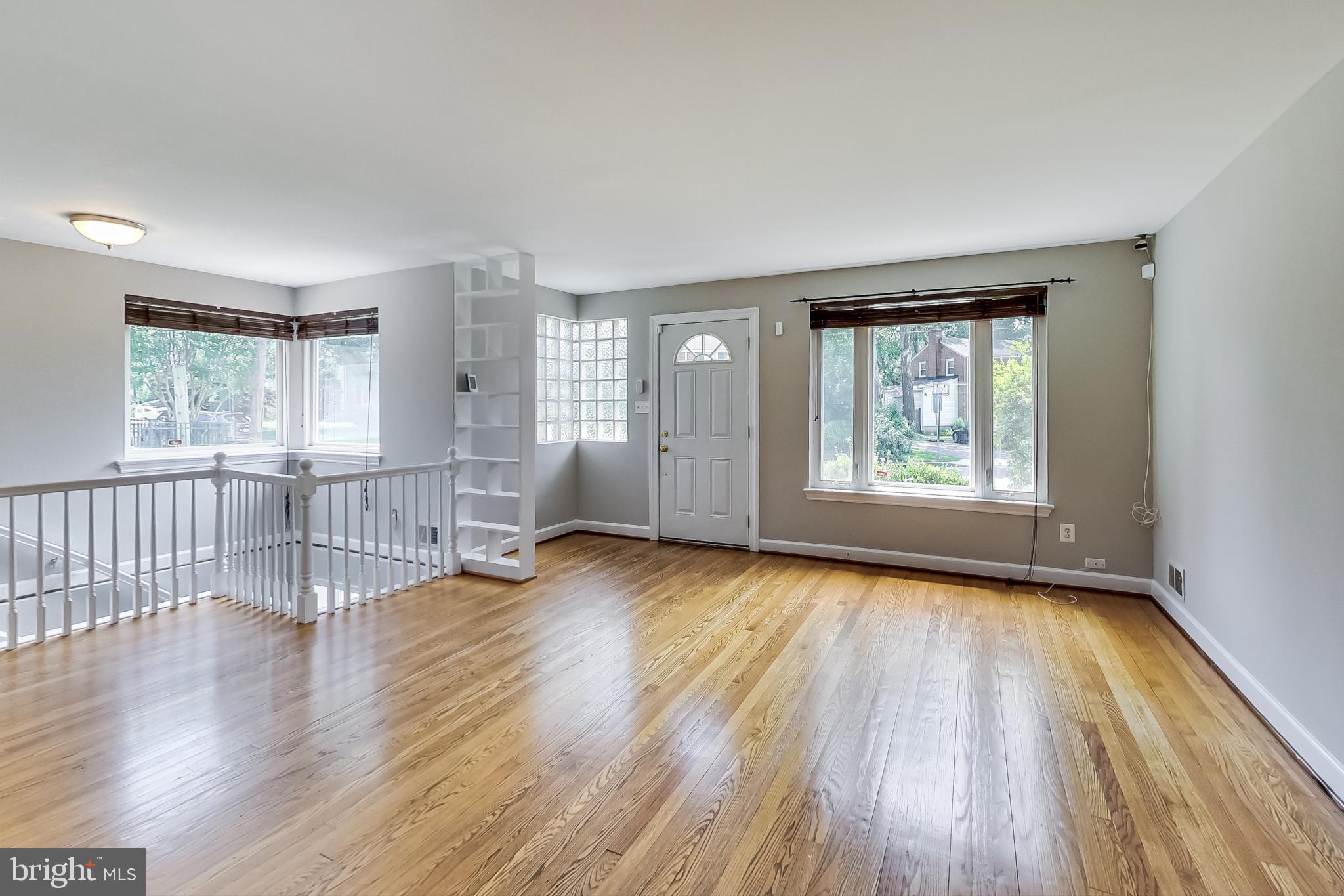 8617 Lynbrook Drive Bethesda, MD 20814 - Photo 2 of 48 an empty room with wooden floor and windows