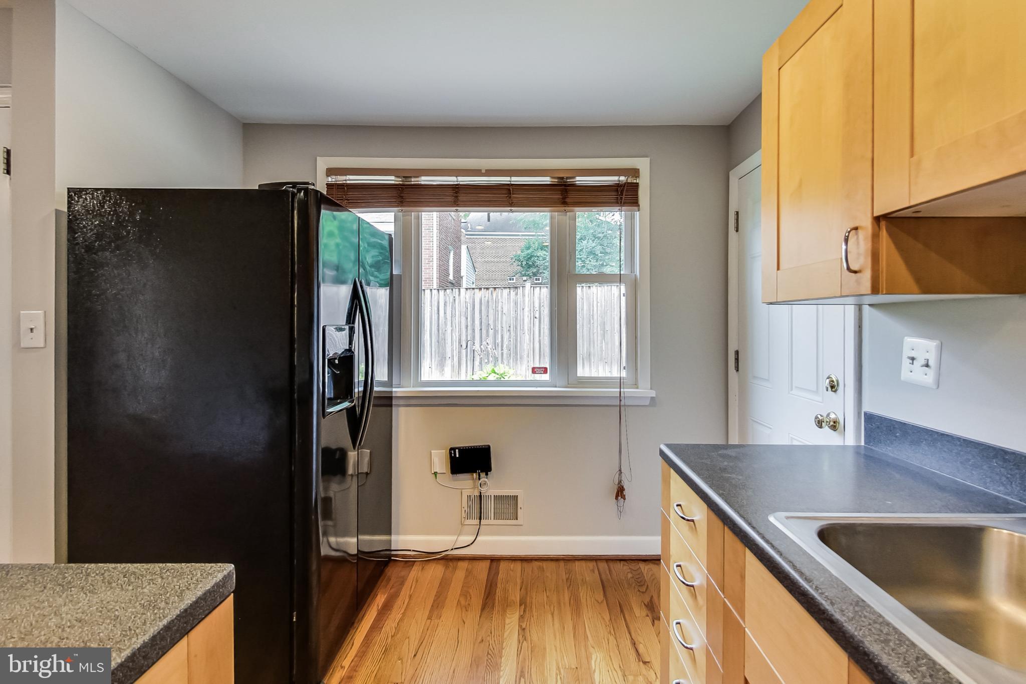 8617 Lynbrook Drive Bethesda, MD 20814 - Photo 21 of 48 a kitchen with stainless steel appliances granite countertop a refrigerator and a sink