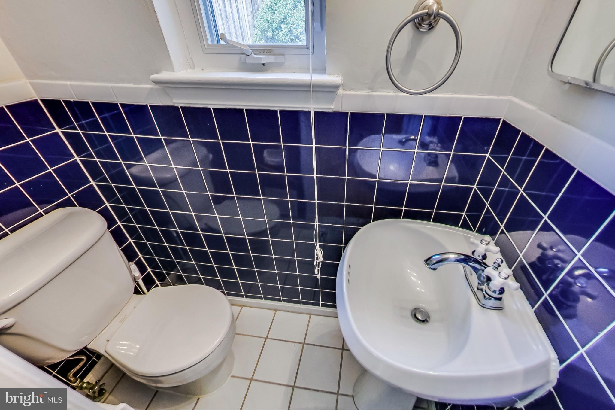 8617 Lynbrook Drive Bethesda, MD 20814 - Photo 22 of 48 a bathroom with a sink toilet and a mirror