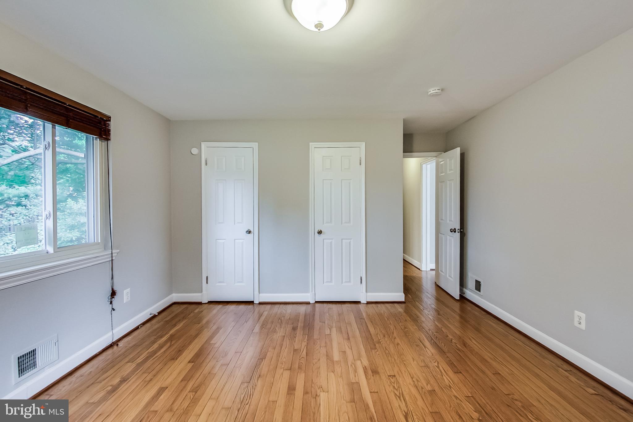 8617 Lynbrook Drive Bethesda, MD 20814 - Photo 24 of 48 a view of a room with wooden floor and window