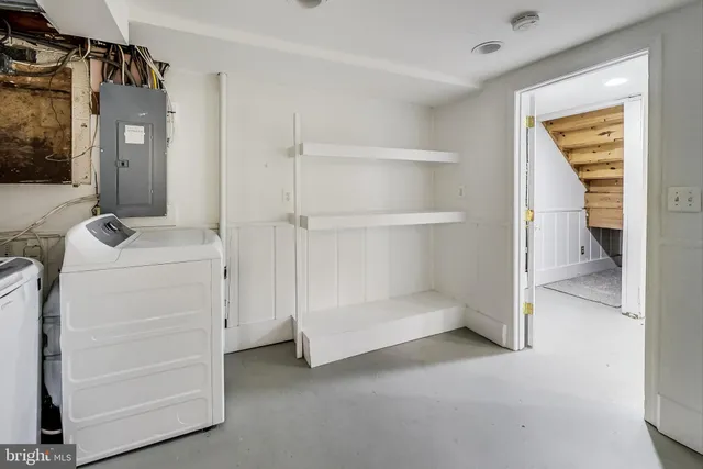 a view of storage and utility room with washer and dryer
