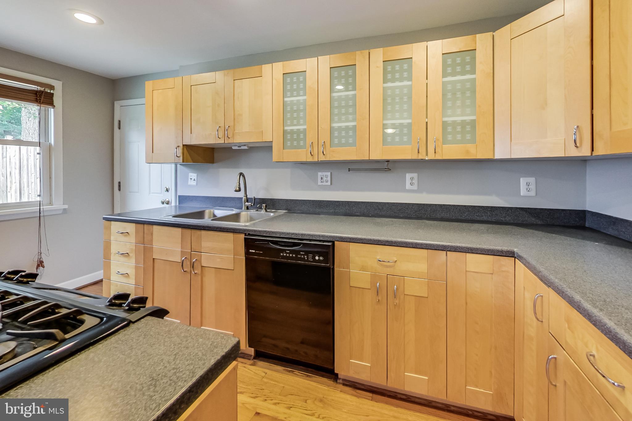 8617 Lynbrook Drive Bethesda, MD 20814 - Photo 4 of 48 a kitchen with a stove a sink and a refrigerator