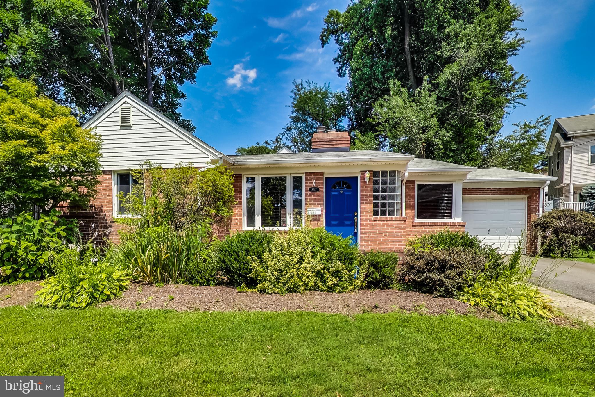 8617 Lynbrook Drive Bethesda, MD 20814 - Photo 10 of 48 a front view of a house with a yard