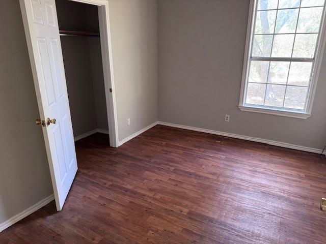 834 Graham Street Paris, TX 75460 - Photo 5 of 8 an empty room with wooden floor and windows