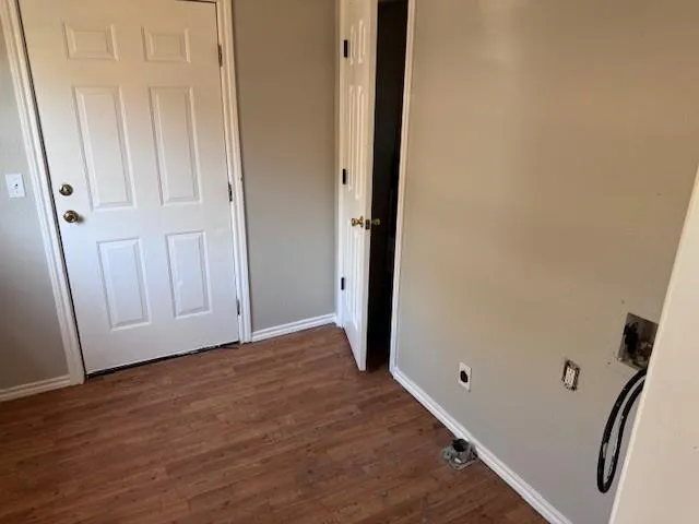 a kitchen with sink cabinets and wooden floor