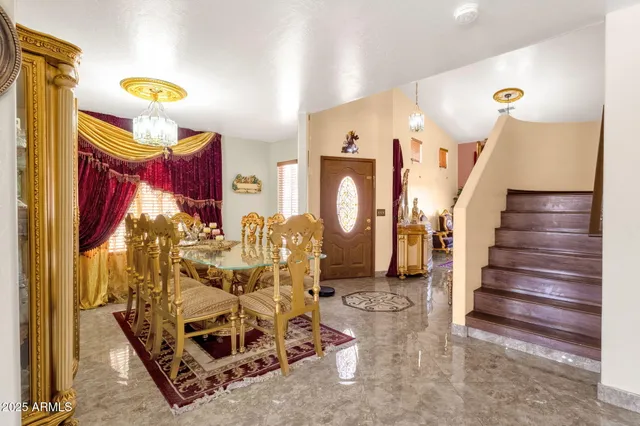 a view of a livingroom with furniture and a chandelier