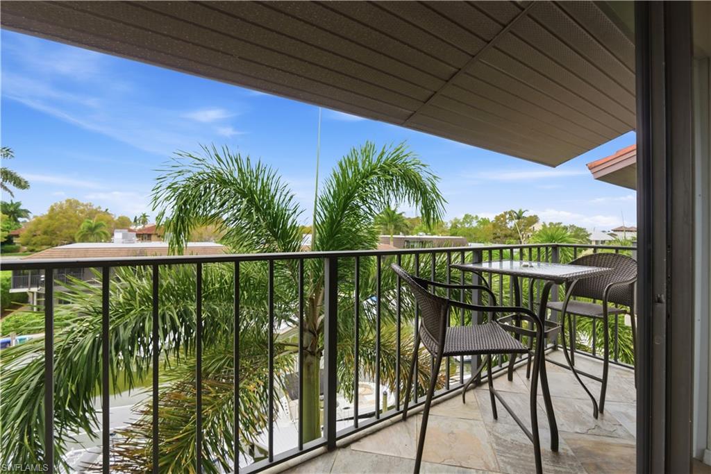 1400 Blue Point Avenue, Unit 206 Naples, FL 34102 - Photo 13 of 19 a view of balcony with furniture