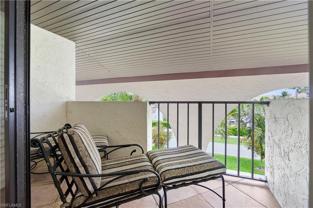 1400 Blue Point Avenue, Unit 206 Naples, FL 34102 - Photo 16 of 19 a view of a two chairs in the balcony