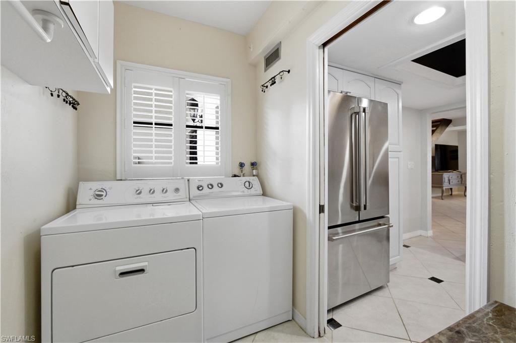 1400 Blue Point Avenue, Unit 206 Naples, FL 34102 - Photo 18 of 19 a utility room with dryer and washer