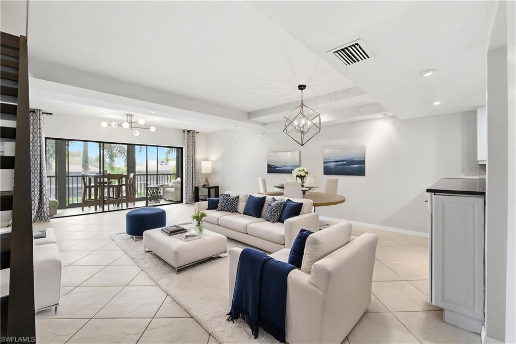 1400 Blue Point Avenue, Unit 206 Naples, FL 34102 - Photo 3 of 19 a living room with furniture and a large window