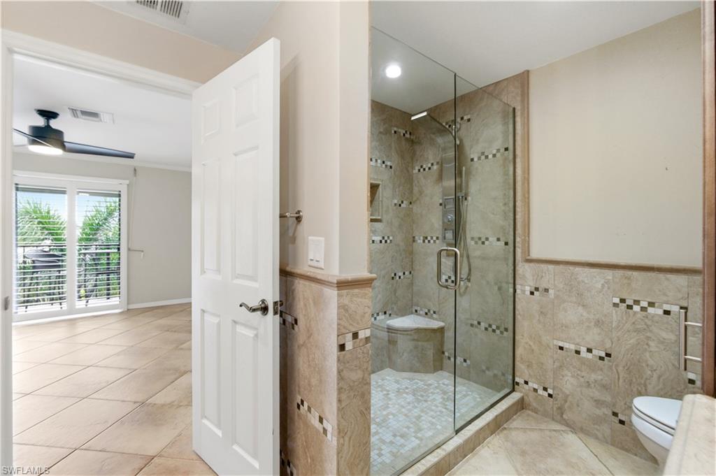 1400 Blue Point Avenue, Unit 206 Naples, FL 34102 - Photo 10 of 19 a bathroom with a shower and a toilet