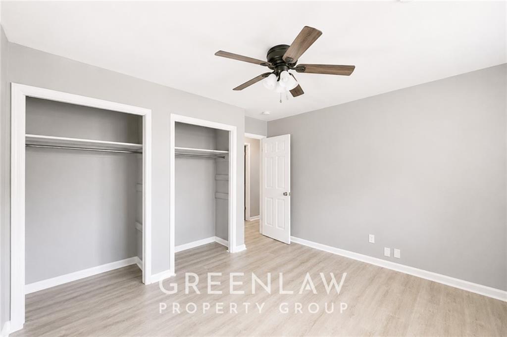 3605 Flat Shoals Road Atlanta, GA 30349 - Photo 26 of 35 a view of a big room with wooden floor and windows in a room
