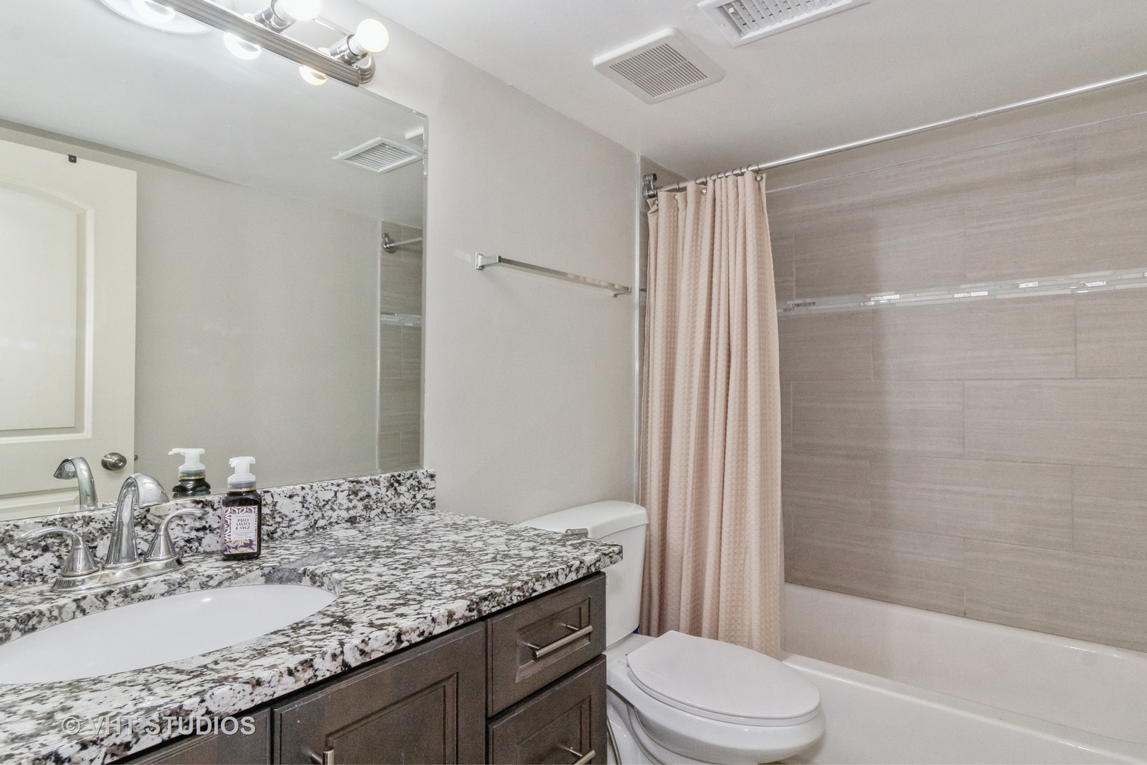 1939 Kenilworth Circle Hoffman Estates, IL 60169 - Photo 15 of 18 a bathroom with a granite countertop sink toilet and shower