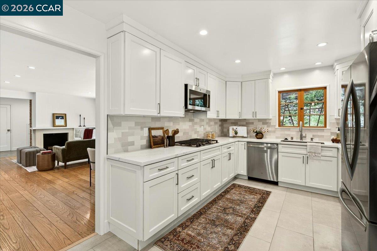 24 Las Vegas Road Orinda, CA 94563 - Photo 14 of 47 a kitchen with a sink a counter top space and appliances